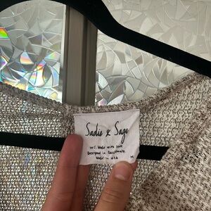 Brown and white sweater, cropped in the front